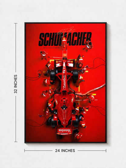 A framed vertical poster featuring a red Formula 1 race car with pit crew members and the word 'SCHUMACHER' in large black letters on a bright red background. White dimension lines indicate 32 inches tall by 24 inches wide, shown against a light gray wall.